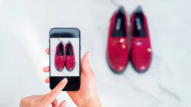 Woman taking a picture of her red shoes for sell on the internet. Selling online ideas concept. Woman taking a picture of her red shoes for sell on the internet. Selling online ideas concept. shoe photos stock pictures, royalty-free photos & images