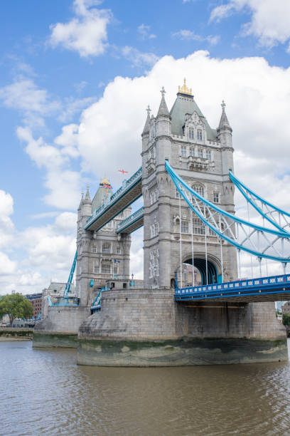 istock The Iconic Tower Bridge Over the River Thames and Under a Cloudy Blue Sky 1286703327