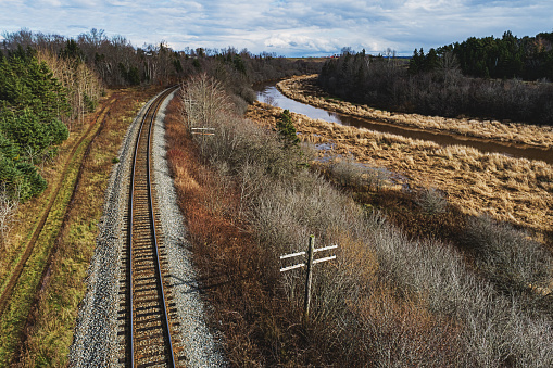 A railroad follows a tidal river in rural Nova Scotia.
