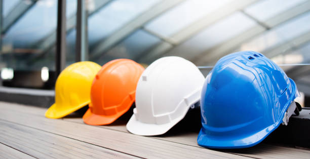 istock Multicolour Safety Construction Worker Hats. Teamwork of the construction team must have quality. Whether it is engineering, construction workers. Have a helmet to wear at work. For safety at work. 1286707493