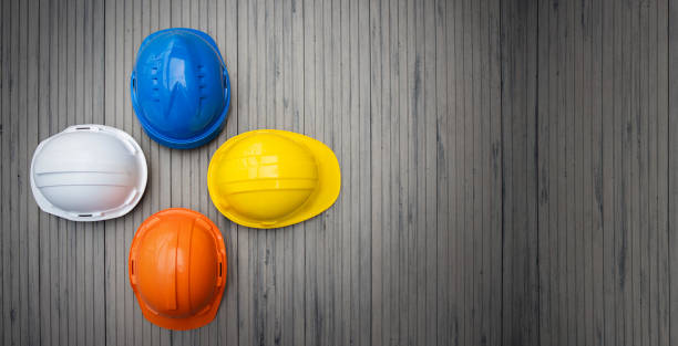 Multicolour Safety Construction Worker Hats. Teamwork of the construction team must have quality. Whether it is engineering, construction workers. Have a helmet to wear at work. For safety at work. stock photo