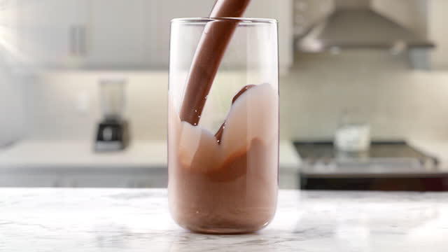 cacao milk drink pouring in kitchen
