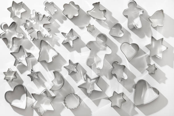 istock Pattern of Christmas-themed cookie cutters on white. 1286709626