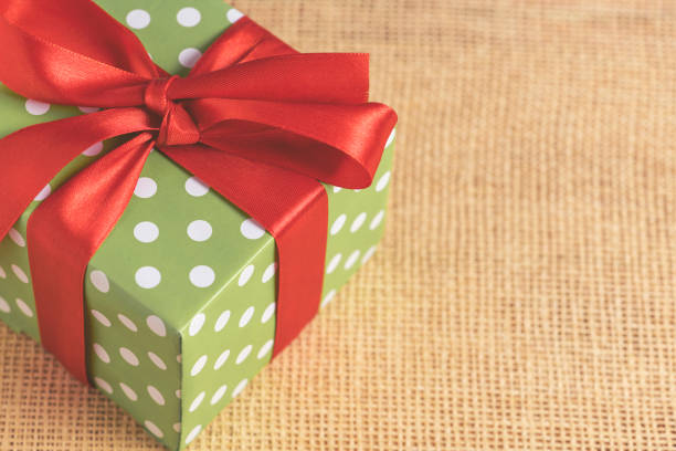 istock Christmas composition. Gift box with red bow. New year decoration. 1286712001