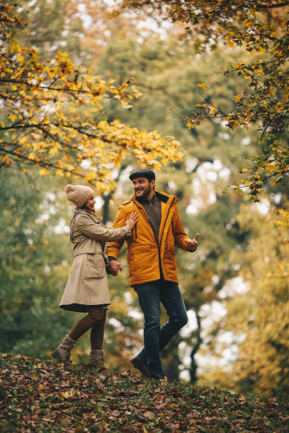 istock Couple is happy together. Autumn forest. 1286712224