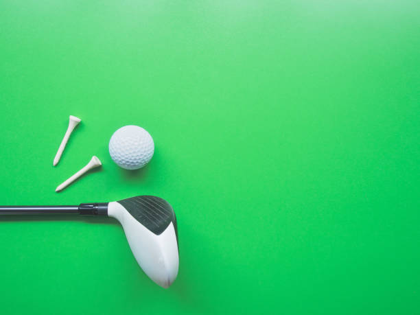 istock Golf equipment flat lay on green background. Top view 1286712954
