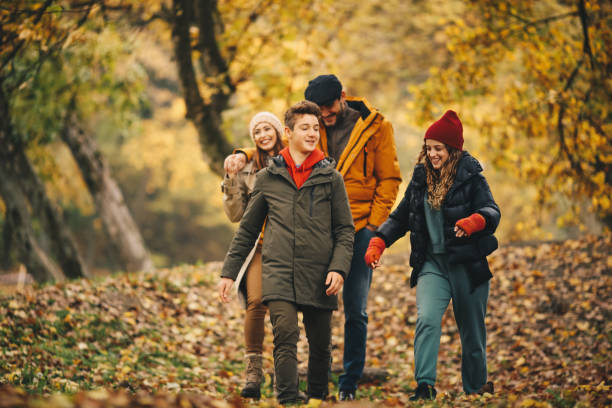 istock Parents with their children in park, having great time. 1286713066