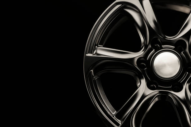 istock matte black alloy wheel, close-up front view. Powerful wheel for off-road vehicles, copyspace 1286713365