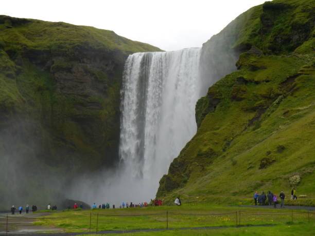 istock Waterfall in Iceland with tourists 1286713379