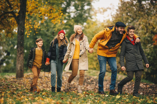 istock Happy family is having great time in Autumn forest. 1286713587