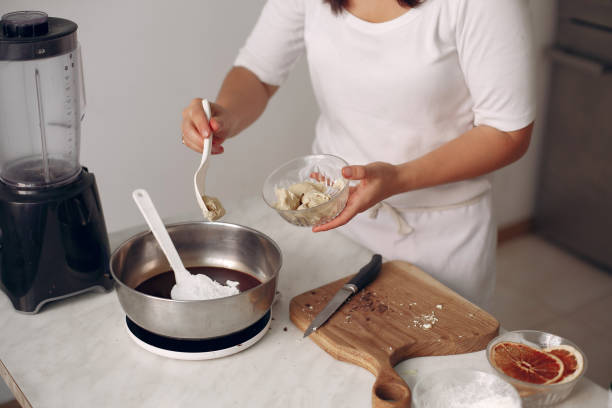 istock Chef in white clothes prepares a chocolate cake 1286714766