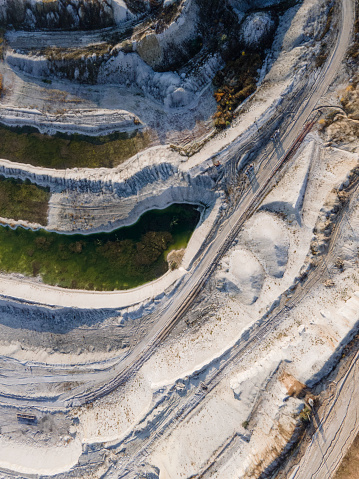 Opencast mining quarry - Aerial view. Industrial Extraction of lime, chalk, calx, caol