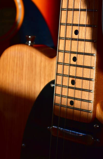 istock Electric guitar background. Maple fretboard and swamp ash body close-up. 1286717455