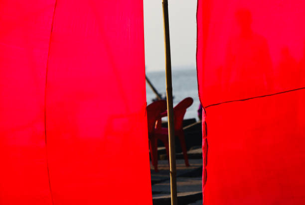istock Red clothes of a protection wall and a bamboo stick 1286717496