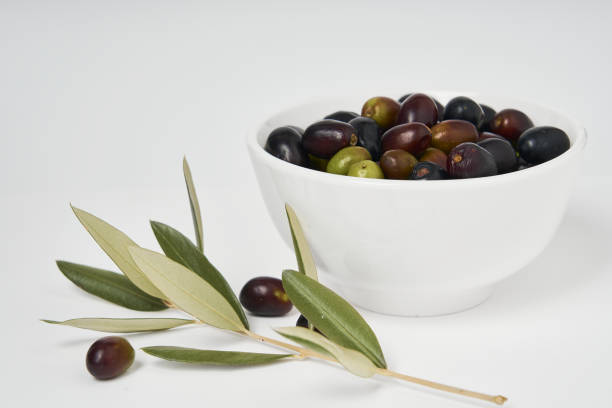 istock Olive branches and freshly picked green and black olives 1286718817