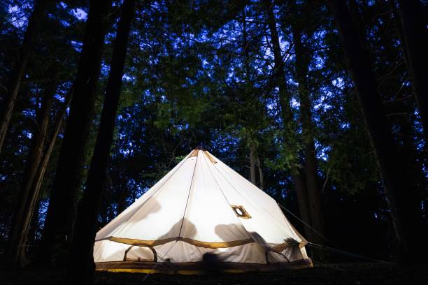 istock Camping in a tent at night time 1286718940