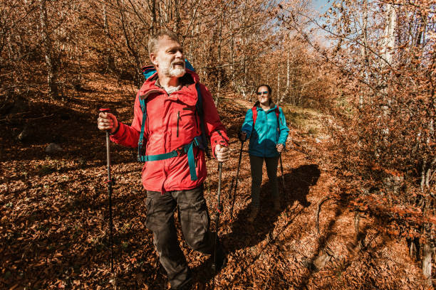 istock Mature Couple Hiking Along Forest Path Together 1286719112