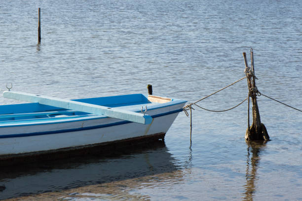 istock Authentic small blue fishing boat 1286719130
