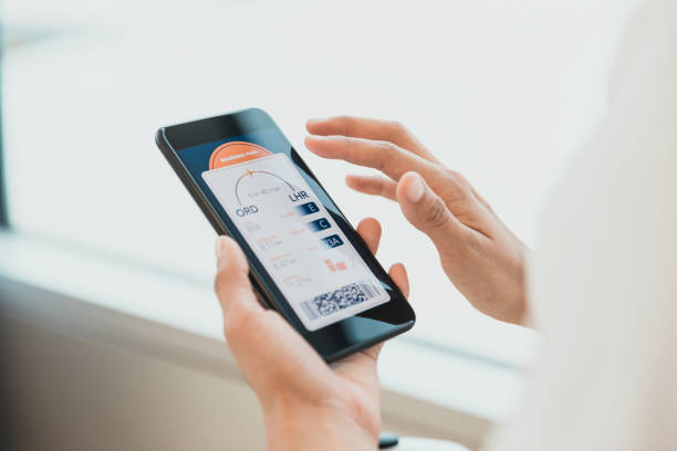 istock Female hands hold smart phone displaying barcoded boarding pass 1286720482