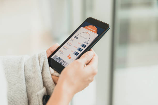 istock Unrecognizable woman holds smart phone with boarding pass on screen 1286720492