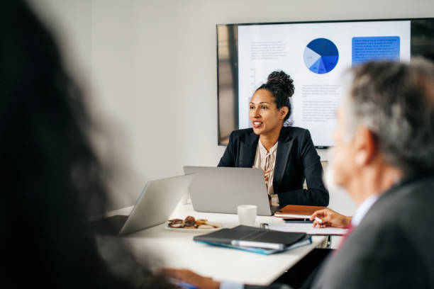 istock Woman presenting a business strategy to her team 1286721594