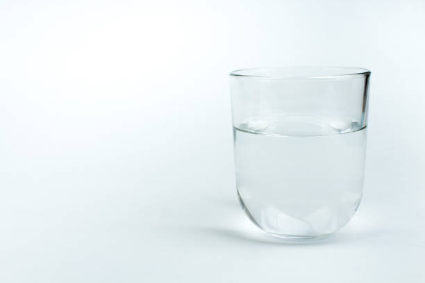 istock glass of clean water isolated on white. 1286723377