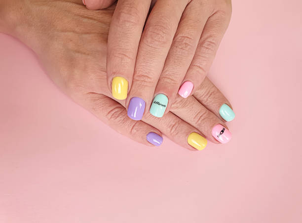 istock female hand beautiful manicure on a colored background 1286723429