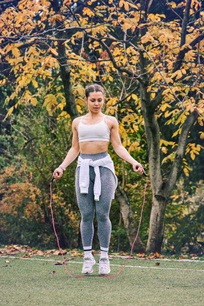 istock Active woman exercising in park 1286727405