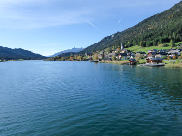 istock Weissensee - A panoramic capture of an endless Alpine lake 1286728675