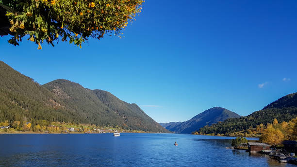 istock Weissensee - A view on the lake surrounded by the mountains 1286728823