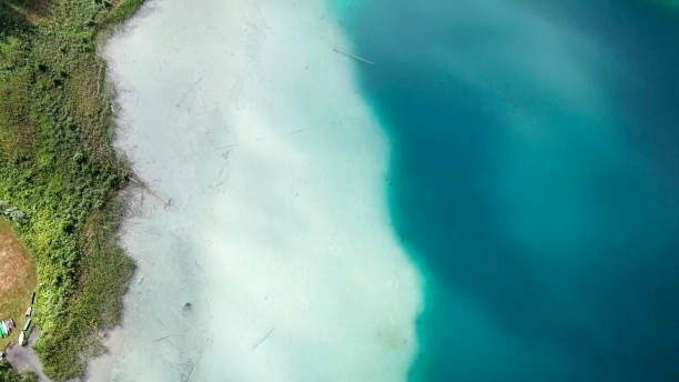 istock Weissensee - A top down drone shot of a turquoise Alpine lake 1286729174