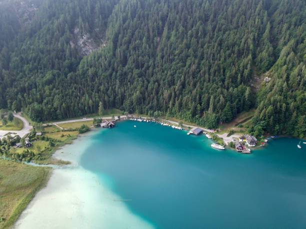 istock Weissensee - A top down drone shot of a turquoise Alpine lake 1286729605