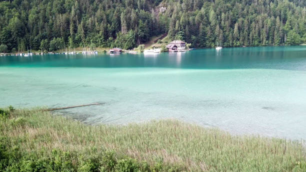 istock Weissensee - A top down drone shot of a turquoise Alpine lake 1286730245