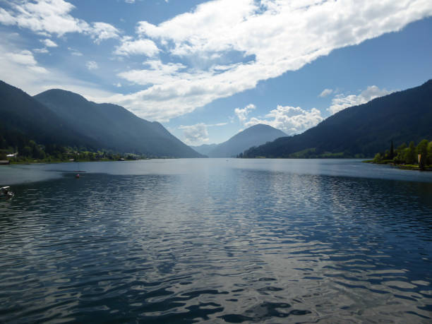 istock Weissensee - A panoramic capture of an endless Alpine lake 1286730304