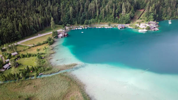 istock Weissensee - A panoramic capture of an endless Alpine lake 1286730325