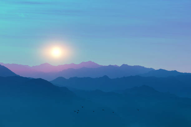 istock Silhouette of mountain ranges against the sunset sky 1286736494