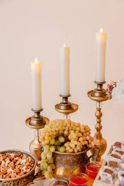 istock A part of wedding buffet table with candles and grape 1286737950