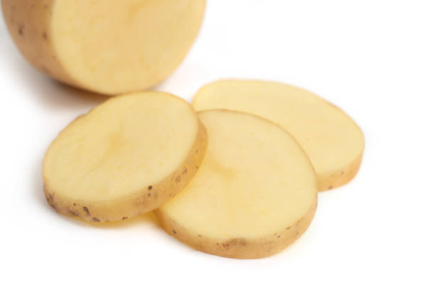 istock Isolated potatoes. raw slice potato vegetables isolated on white background 1286738352