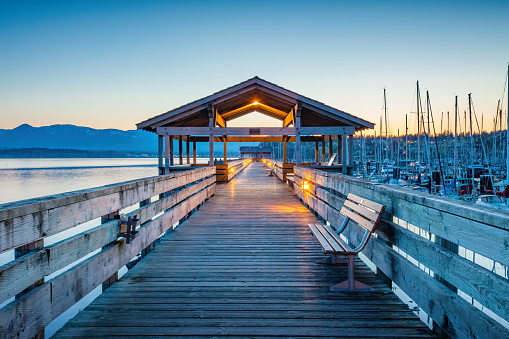 The Comox Fisherman’s Wharf boardwalk in Comox, Vancouver Island, BC,  Canada at twilight.