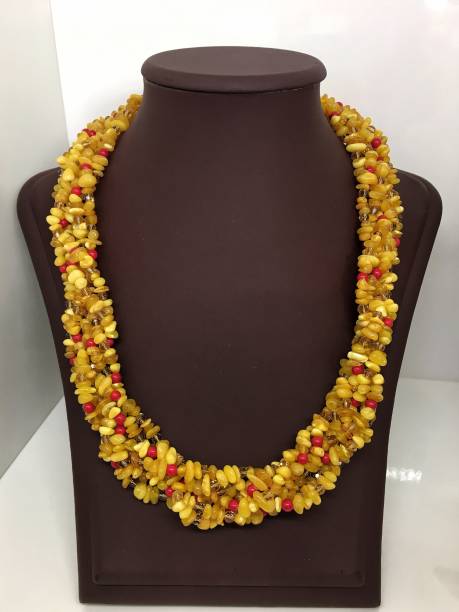 istock Handmade amber bead necklaces in a shop window. 1286744472