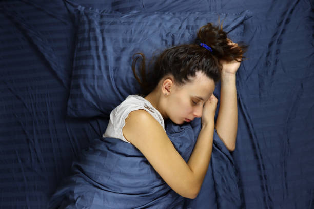 istock young woman sleeping on a pillow in bed 1286745047