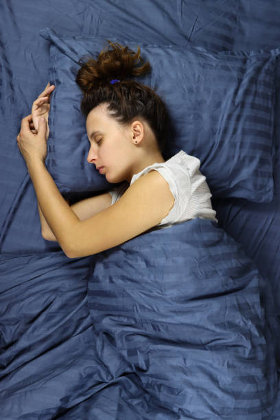 istock young woman sleeping on a pillow in bed 1286745742
