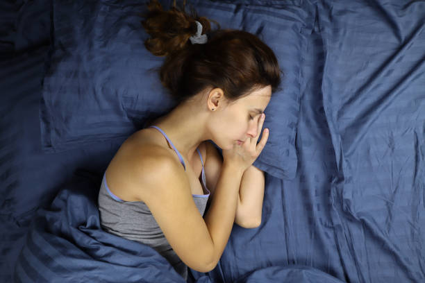 istock young woman sleeping on a pillow in bed 1286745767