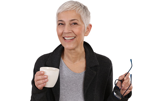 Joyful and stylish Mature Woman drinking coffee, enjoy little things concept