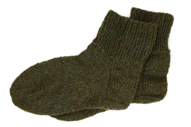 istock pair of wool knitted winter socks isolated on white 1286747089