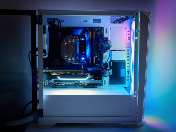 istock Gaming PC and CPU cooling fan with backlight. Desktop gaming computer with RGB led light inside. Concept of eSports and gaming. 1286747376