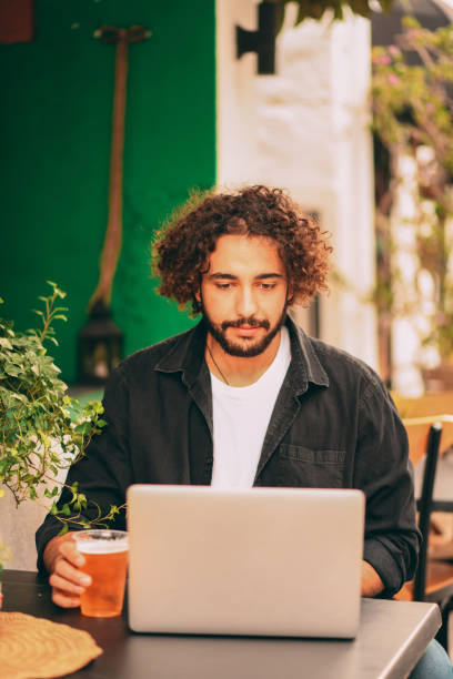 istock Handsome Young Man Working Freelance in Cafe 1286747437