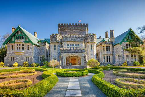 Hatley Castle, a historic mansion, in Victoria, British Columbia, Canada on a sunny day. It was built in the early 20th century as a family residence for James Dunsmuir and his wife Laura. It houses the public Royal Roads University.
