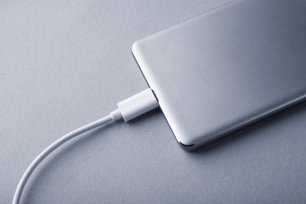 istock Charging a mobile phone connected to electricity for recharging. 1286749948