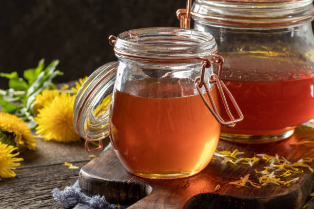 istock Dandelion honey in glass jars 1286750643